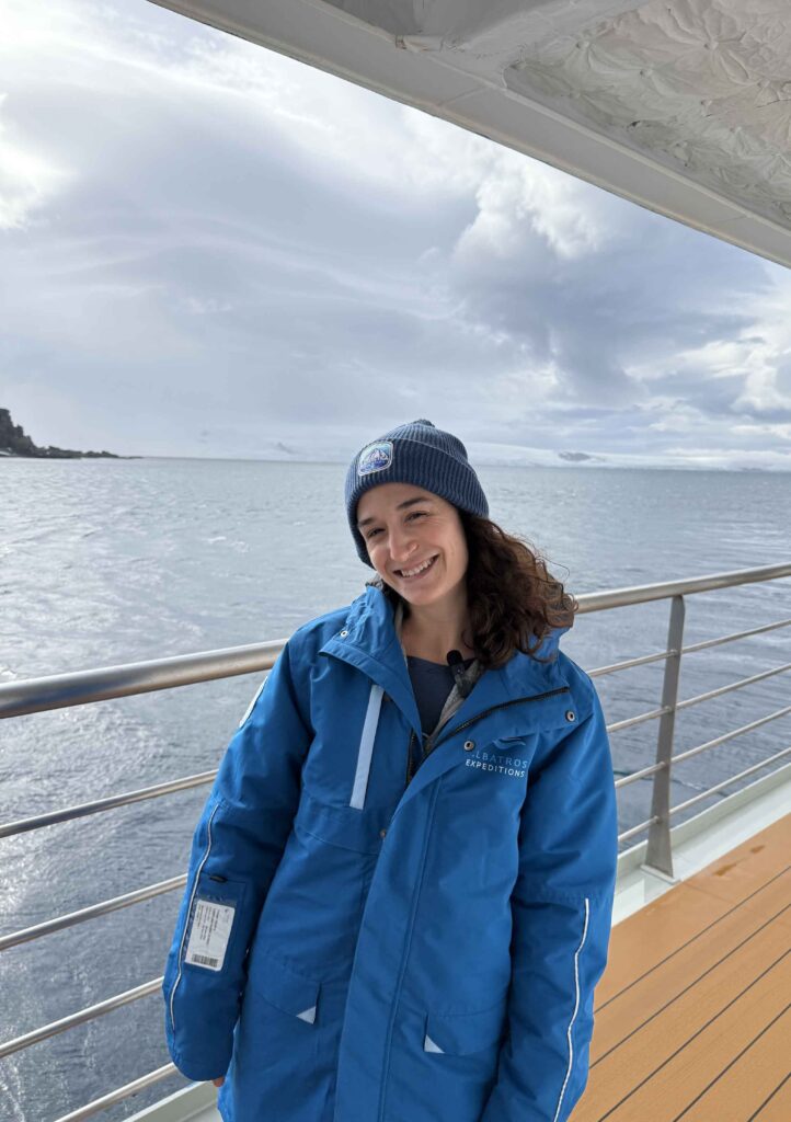 woman similing with stunning background of antarctica landscape